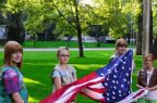 1280px-Girl_Scouts_raising_the_American_flag